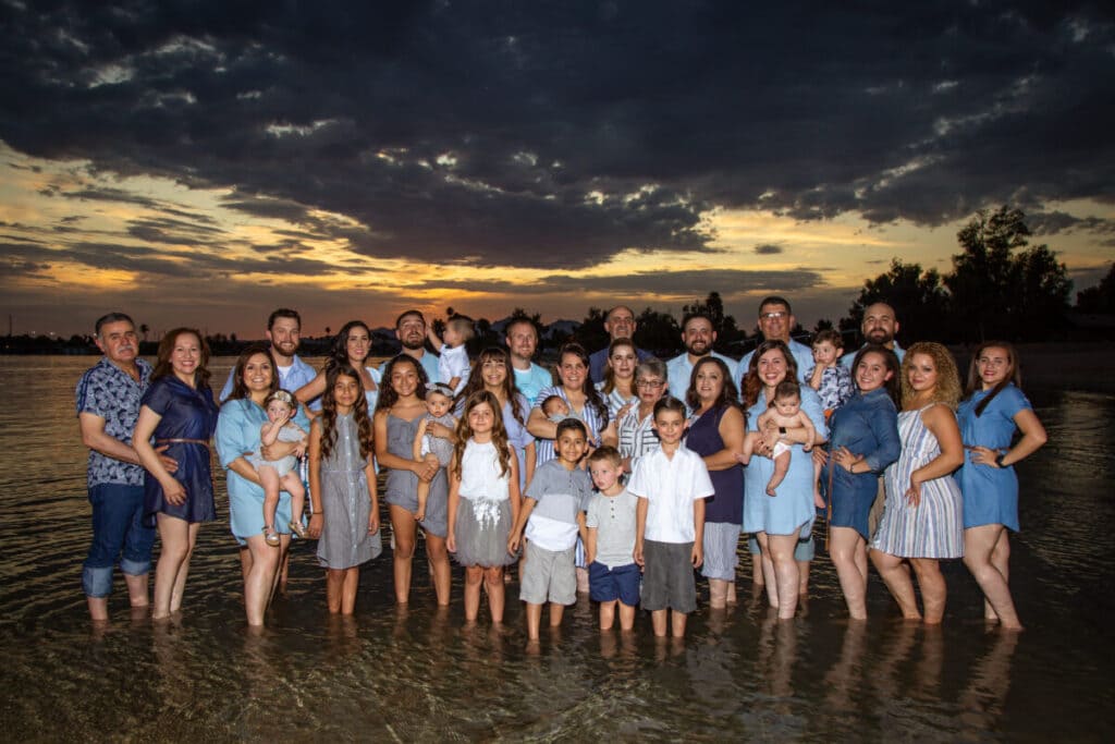 Large family sunset photo in lake