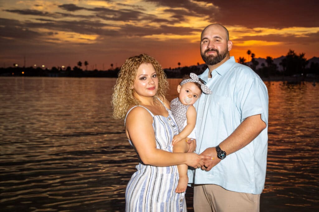 Colorful sunset family photo in lake